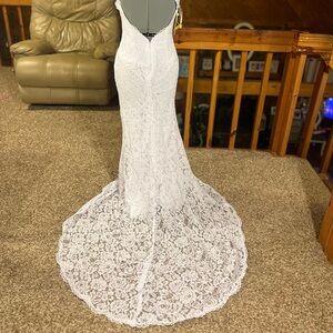 Elegant White Lace Gown
never worn